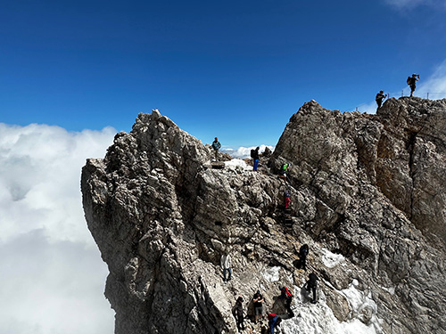 Train ride + gondola brought us to the top of Zugspitze, complete with glacier and dangerous "at your own risk' peak climb - which of course Deeken had to do!